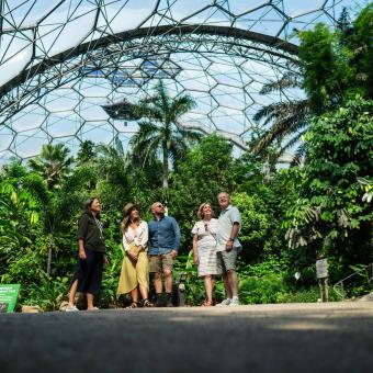 Tour guide showing visitors the Rainforest Biome